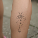 folge der Sonne Palme Tattoo