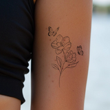 Blume mit zwei Schmetterlingen Tattoo