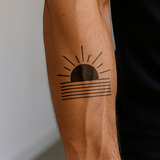 Geometrischer Sonnenaufgang Tattoo